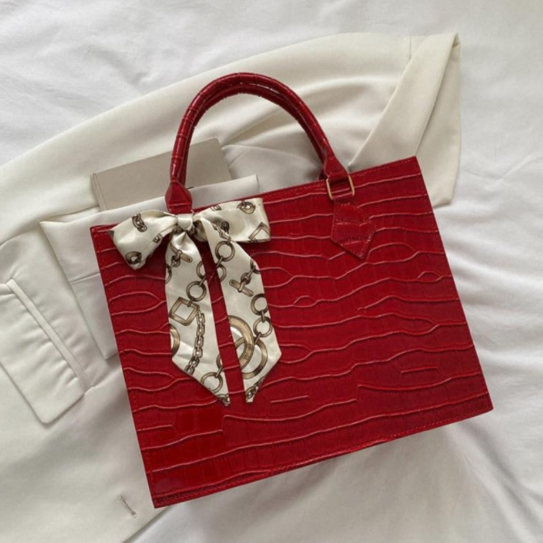 Luxury Handbag with Scarf Detailing