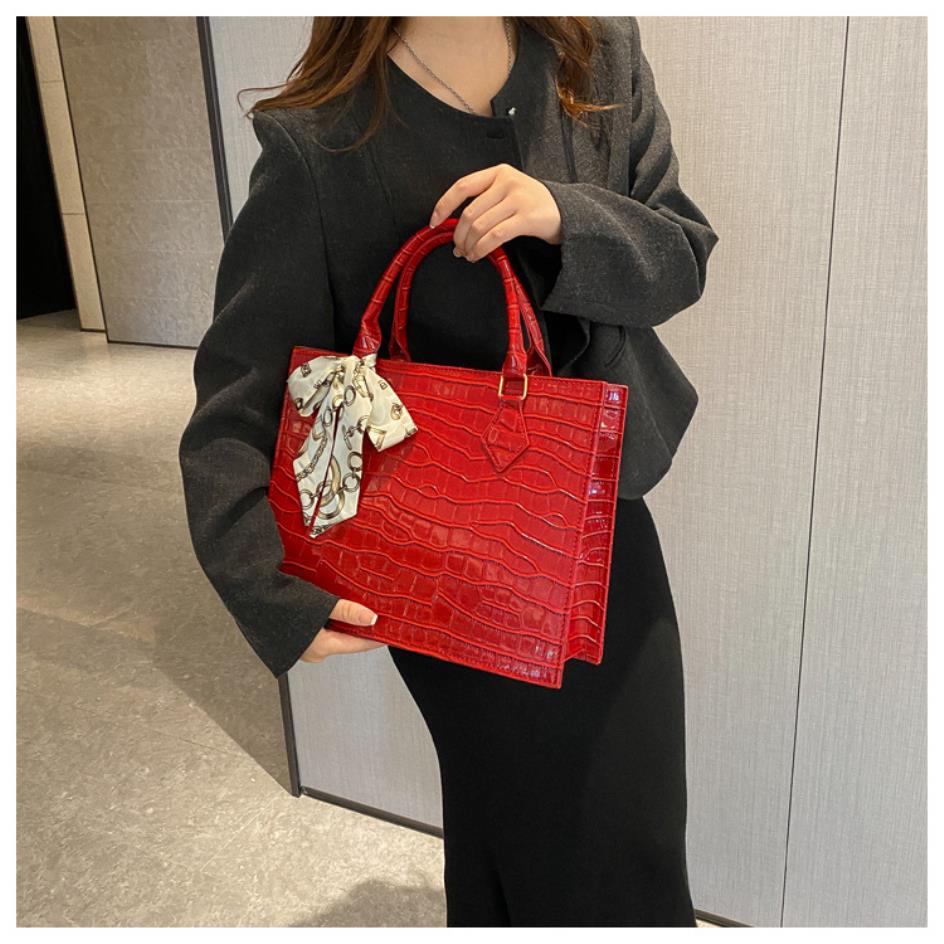 Luxury Handbag with Scarf Detailing