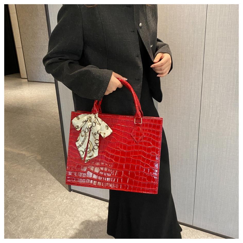 Luxury Handbag with Scarf Detailing