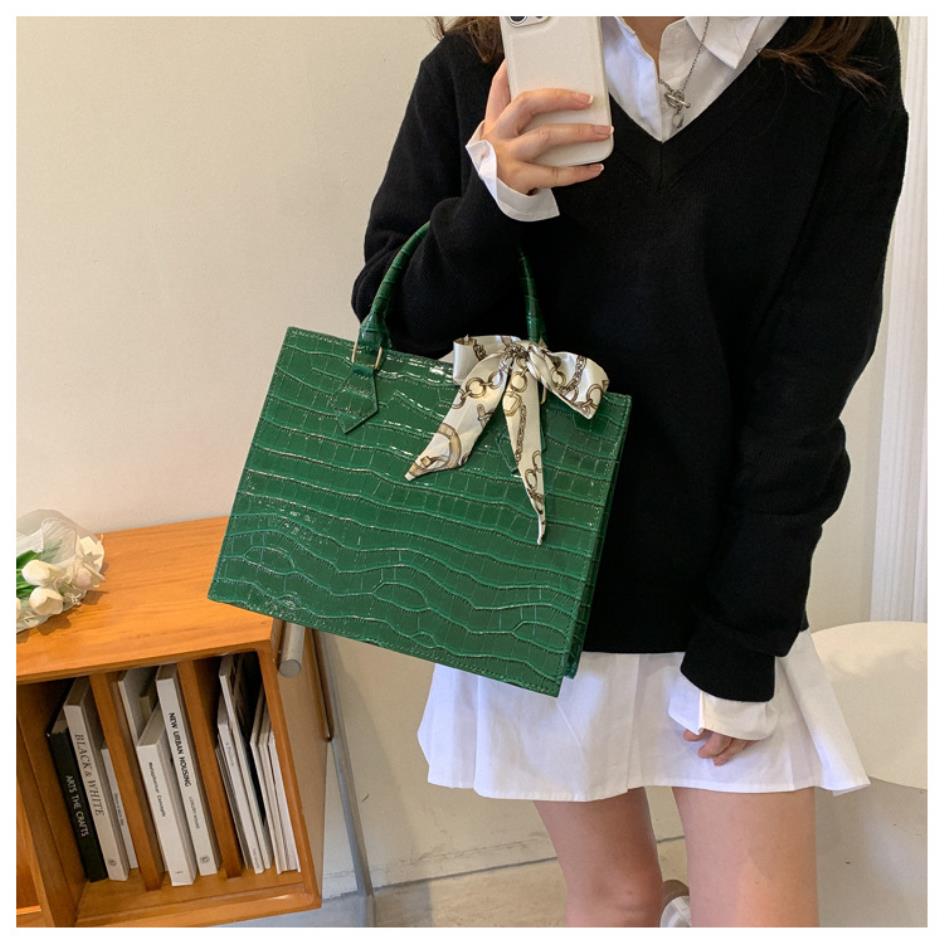 Luxury Handbag with Scarf Detailing