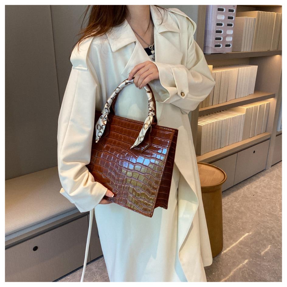 Luxury Handbag with Scarf Detailing