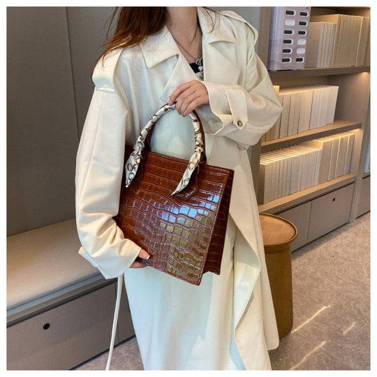 Luxury Handbag with Scarf Detailing