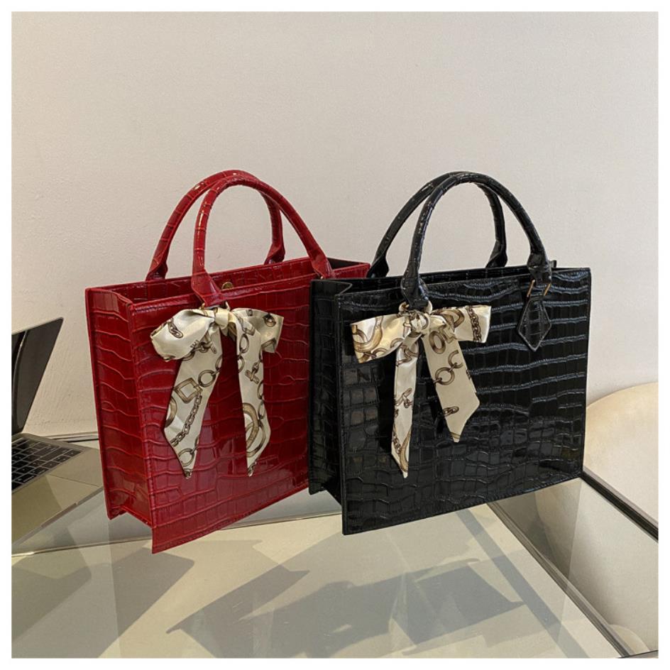 Luxury Handbag with Scarf Detailing