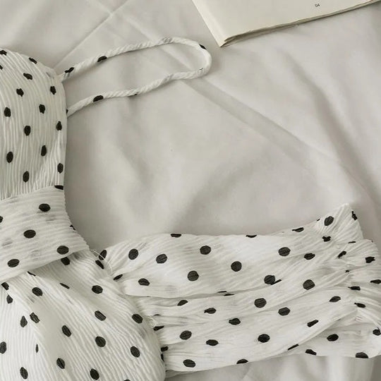 Linda Asymmetrical dotted peplum top