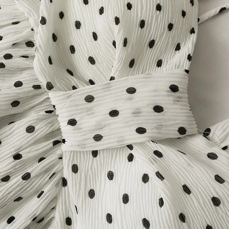 Linda Asymmetrical dotted peplum top