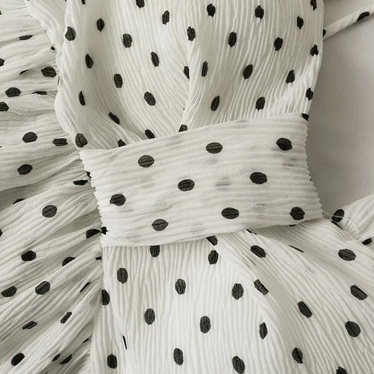 Linda Asymmetrical dotted peplum top